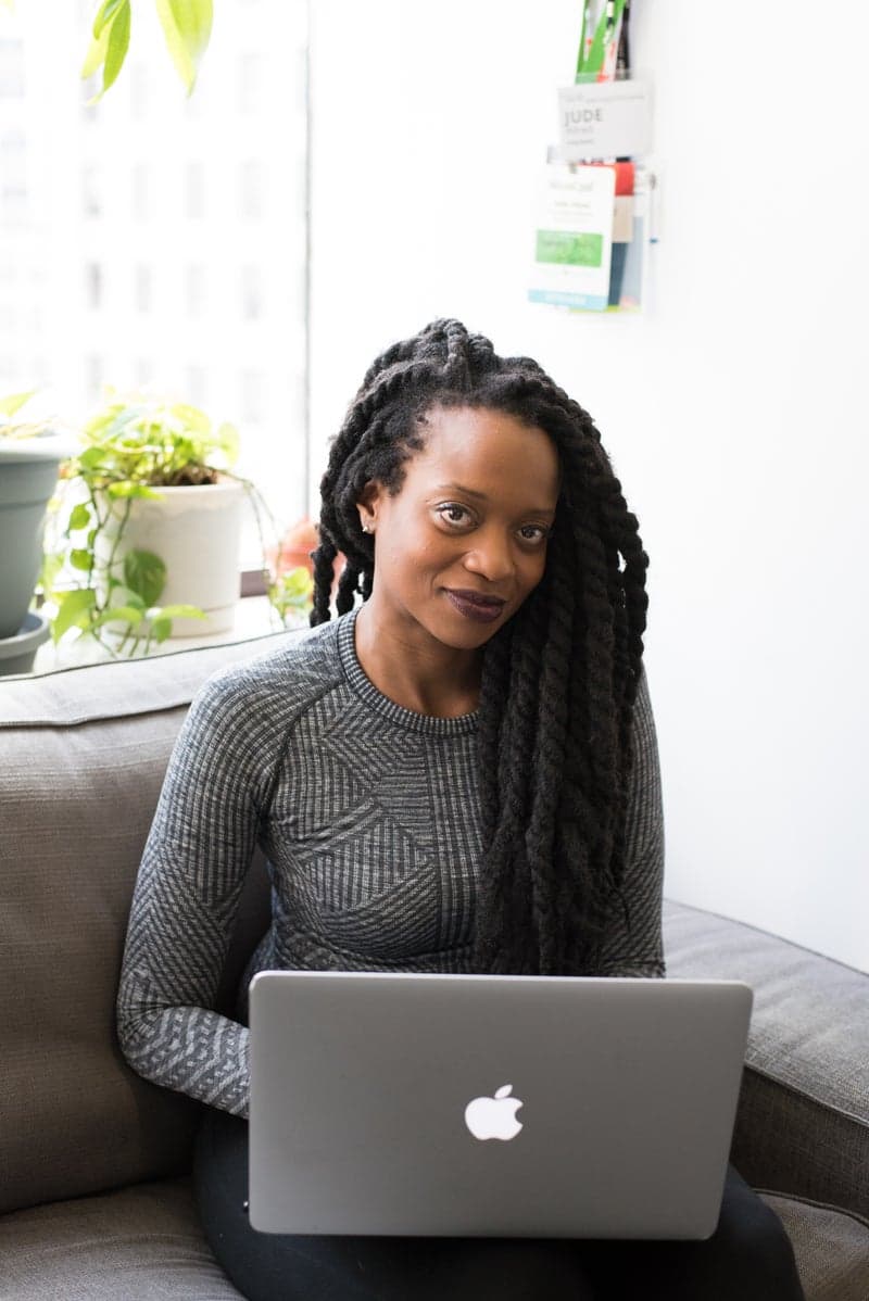 African woman entrepreneur working on laptop